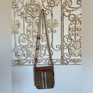 Coach crossbody bag. Bought at Coach outlet. Brown logo fabric